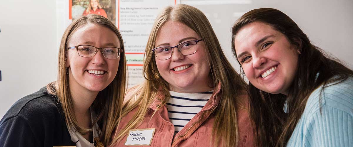 Three AECM students pose for a photo during the 2019 AECM Showcase.